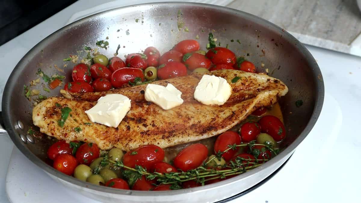 Mediterranean Baked Fish with Seared Basa, Tomatoes, and Olives