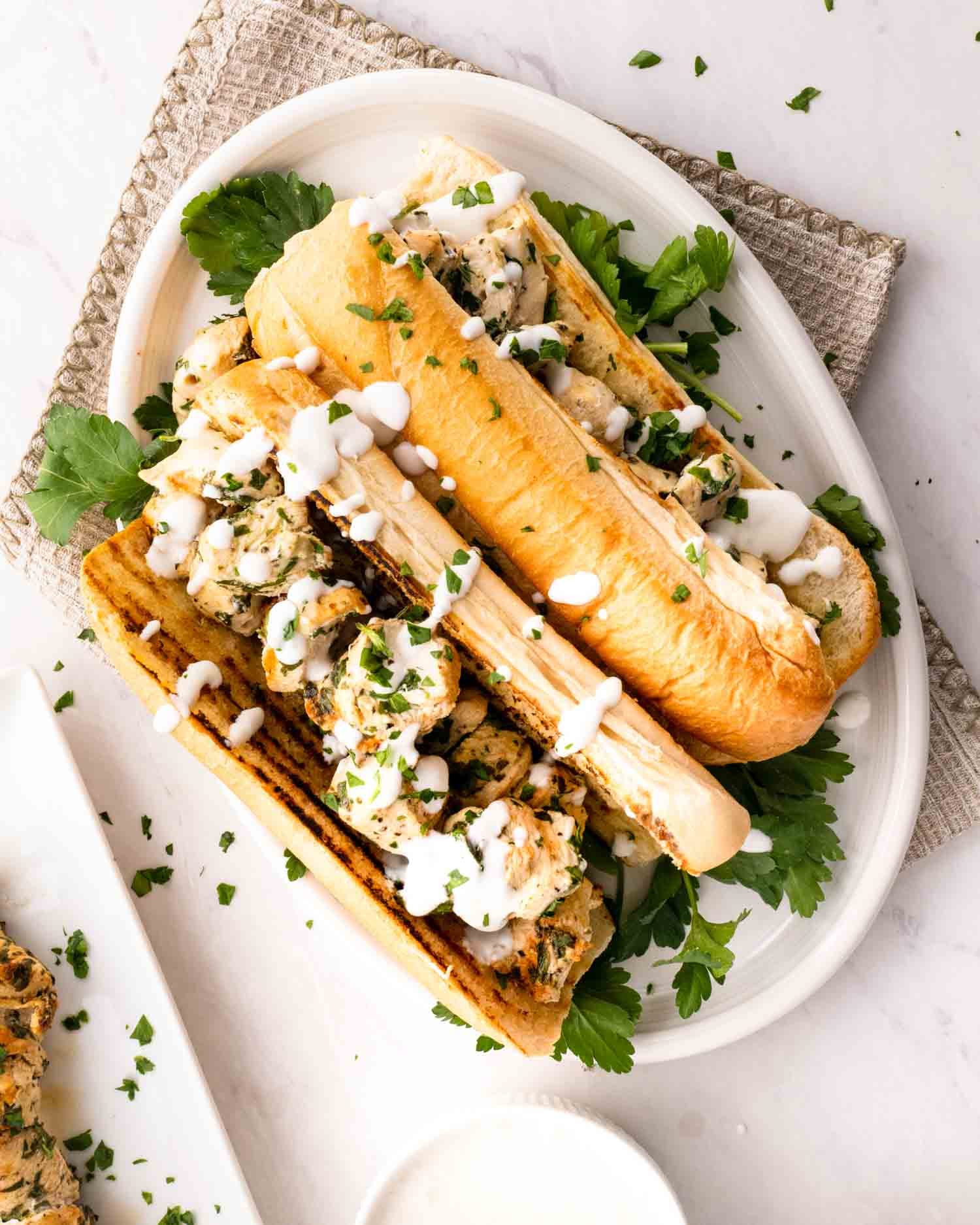 Marinated Chicken Spiedies With Toasted Italian Rolls and Garlic Sauce